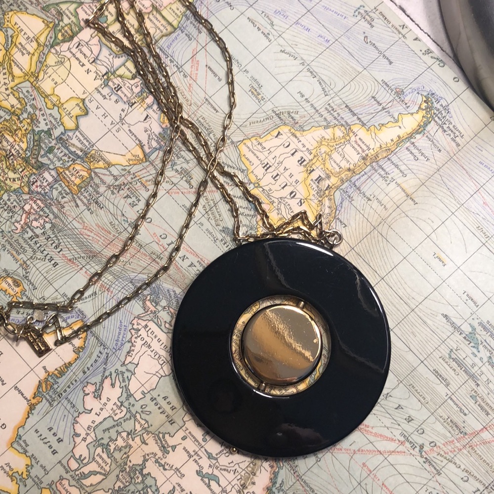 Kate Spade black and gold medallion necklace.